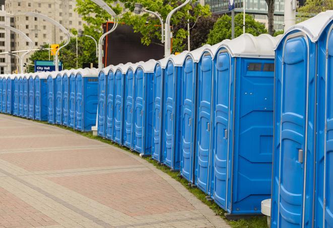 a row of portable restrooms at a fairground, offering visitors a clean and hassle-free experience in selmer